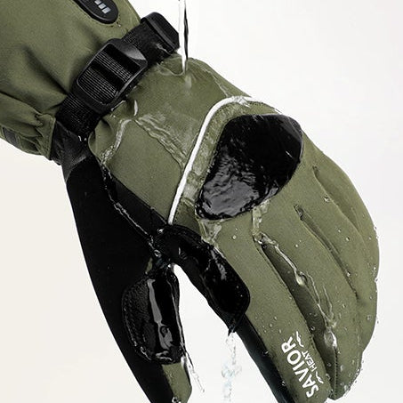 Water-resistant heated gloves in green showing waterproof protection as water rolls off the surface, ideal for skiing, snowboarding, and extreme cold weather.