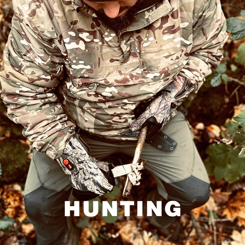 Heated hunting gloves with camouflage design, providing warmth and grip for outdoor hunting in cold weather.
