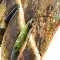 Camo fabric detail on heated hunting gloves.