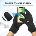 Black heated gloves with a touchscreen-friendly fingertip being used to operate a smartphone outdoors in winter.