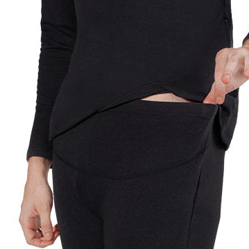 Close-up of black heated underwear showing discreet waistband pocket opening for battery placement.