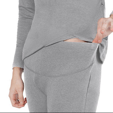 Close-up of gray heated underwear showing discreet waistband pocket opening for battery placement.