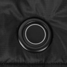 Round power button on black heated vest, showing simple one-touch heating control.